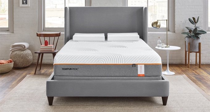A Tempurpedic mattress on a box spring