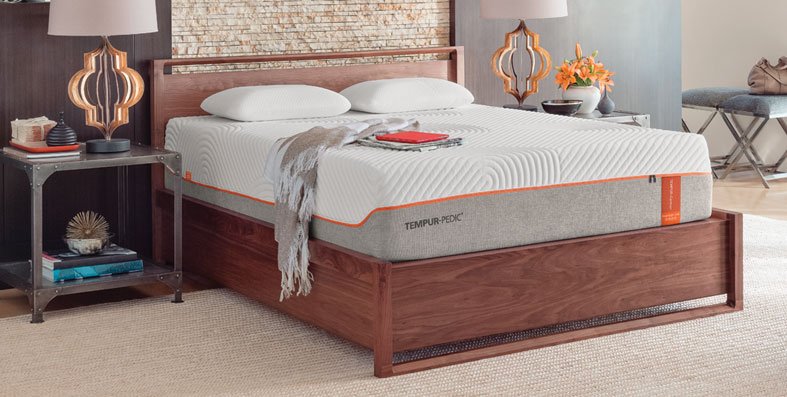 Tempurpedic mattress on a wooden slatted bed