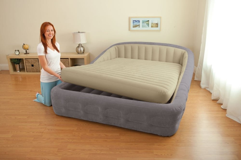 A lady getting her air bed ready
