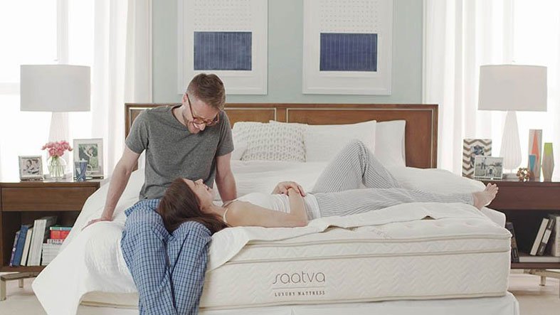 Couple using a Saatva bed